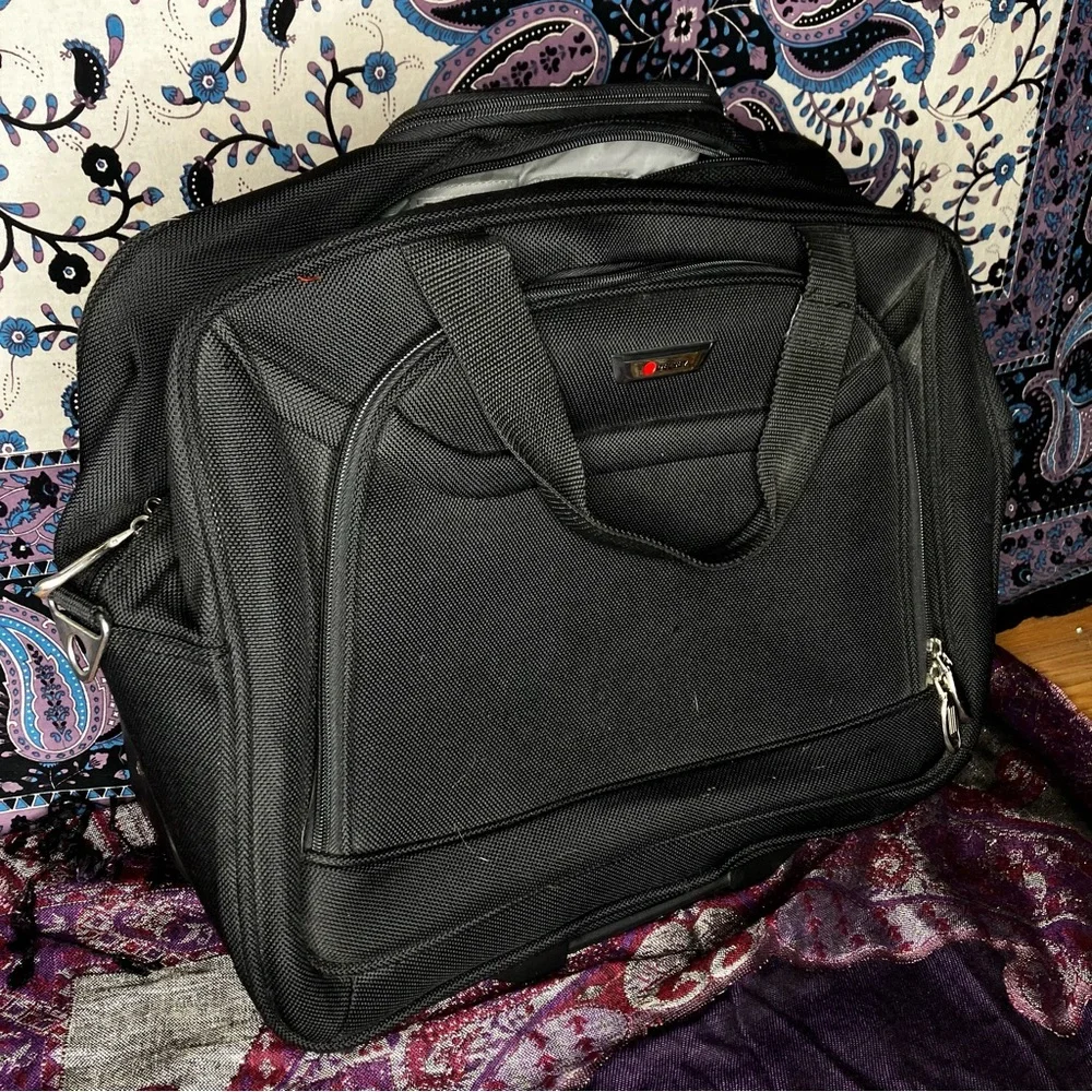 Delsey rolling carry on luggage bag